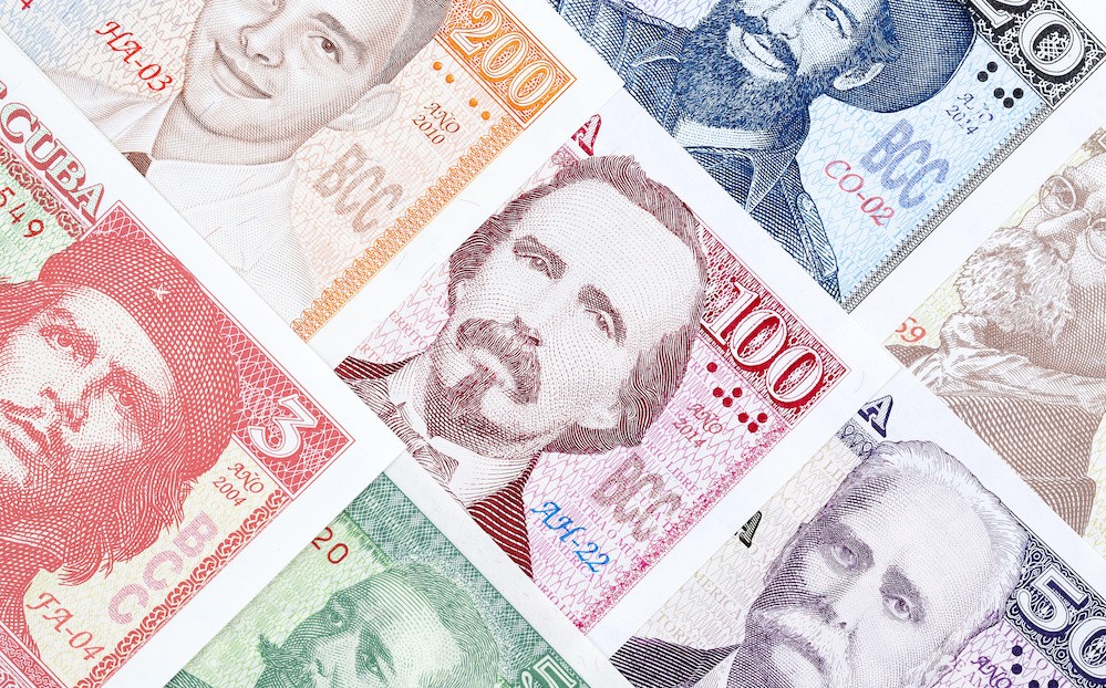 Cuban banknotes of various colors with the faces of Cuban historical figures