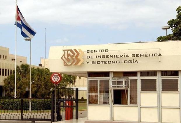 Image of a one-story building with the Cuban flag on the left.