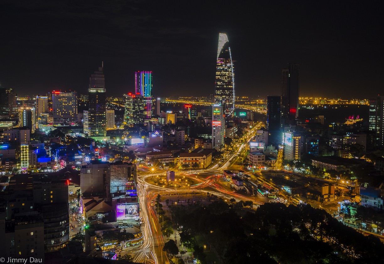 Vietnamese city at night brightly lit buildings