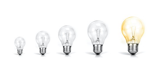 Five lightbulbs increasing in size from left to right, with the last bulb lit up