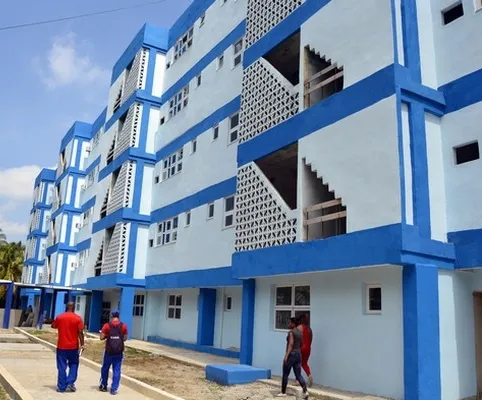 apartment building painted in blue and white
